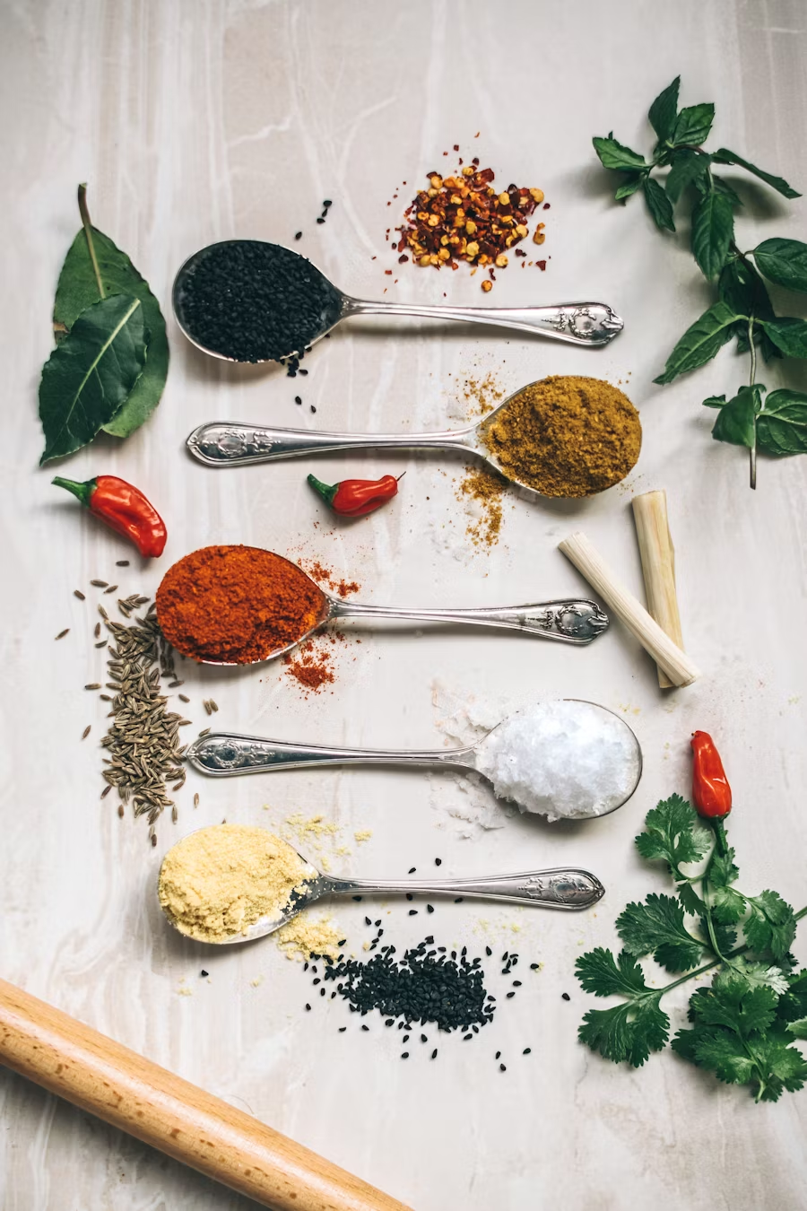 Colorful array of spices and seasonings in organized containers
