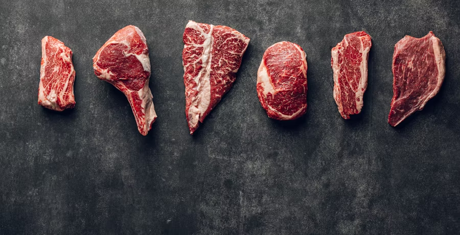 Premium meat cuts on dark surface